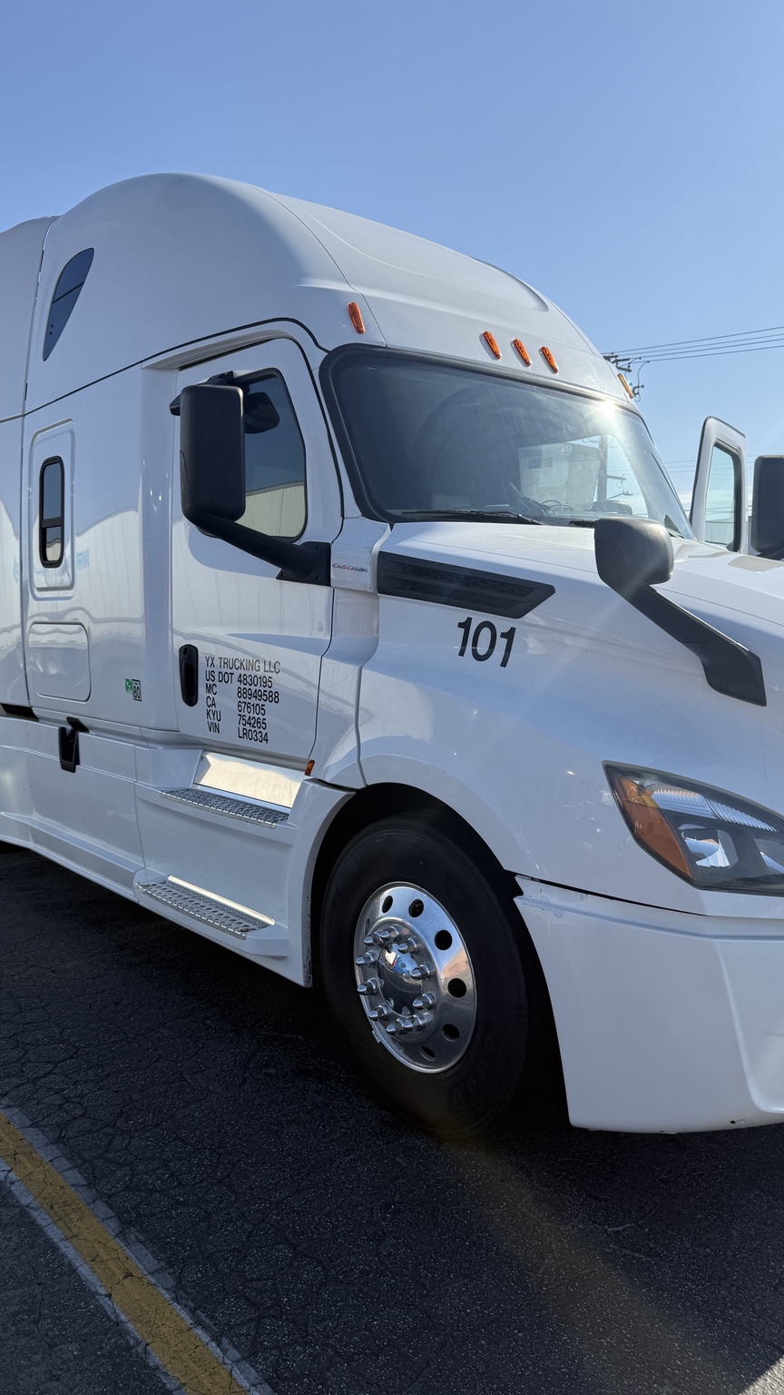 YX Trucking LLC Truck 101 front three-quarter view